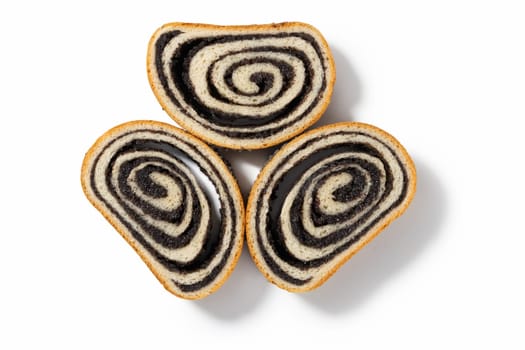 Explore the three of German poppy seed cake slices, each boasting a moist texture and flavorful poppy seed filling, set against a pristine white background.