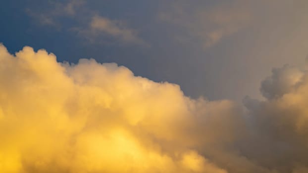 Big yellow cloud in the sky in the evening sun