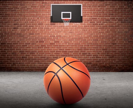 Basketball ball and basketball hoop on brick wall and cement floor