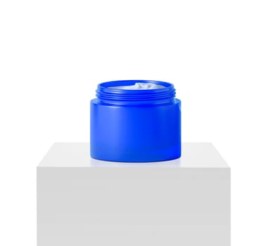 blue jar beauty cream container on podium white square