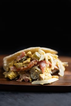close up of greek chicken pita sandwich