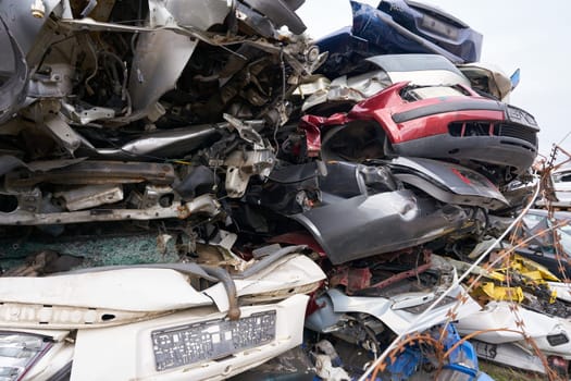 Cars in a scrap yard of a car recycling company in an industrial area in Magdeburg in Germany