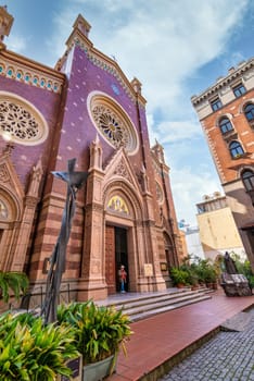 Istanbul, Turkey - May 13, 2023: Modern art statue of Jesus Christ in front of St. Anthony of Padua Church, the largest Roman Catholic Church in Istanbul, located in Istiklal Street
