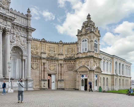 Istanbul, Turkey - May 10, 2023: Side tower at the grand entrance to the 19th century Ottoman Dolmabahce Palace. The entrance is decorated with intricate carvings