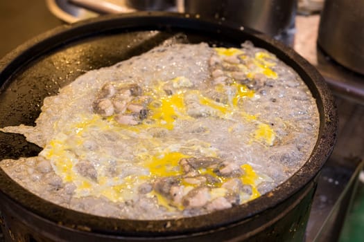 Cooking Taiwan famous Oyster omelette in local food store