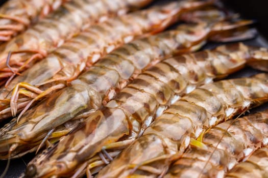 Fresh raw shrimp on grill pan