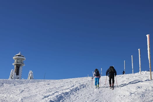 Ski tourers on the way to the Feldberg summit at the beginning of winter  In picture-perfect weather with blue skies,pure sunshine and over half a metre of snow,the ski season was opened on the 1,493-metre-high Feldberg (Breisgau-Hochschwarzwald district). Several hundred winter sports enthusiasts frolicked in the snow on skis and snowboards. Others took the opportunity for a first winter walk or a toboggan ride in a dreamlike snow-covered winter landscape on the Höchsten. But in the next few days the weather is expected to become more unstable again