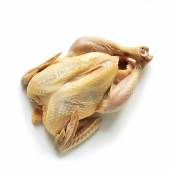 Raw whole chicken isolated on a white background, ready for cooking