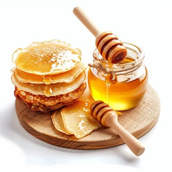 A stack of fluffy pancakes drizzled with golden syrup sits on a wooden plate. A wooden spoon rests beside the pancakes