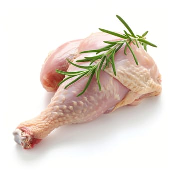 A close-up photo of a raw chicken leg with rosemary sprigs tucked underneath. The chicken leg has smooth, pink skin and rests on a white background
