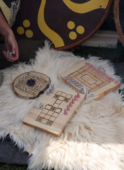 Cracow, Poland - April 11, 2023: Ancient board games in knight camp at the festival of historical reconstruction