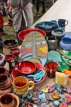 Cracow, Poland - April 11, 2023: Handmade imitations of medieval ceramic vessels in knight camp at the festival of historical reconstruction