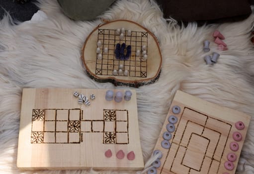 Cracow, Poland - April 11, 2023: Ancient board games in knight camp at the festival of historical reconstruction