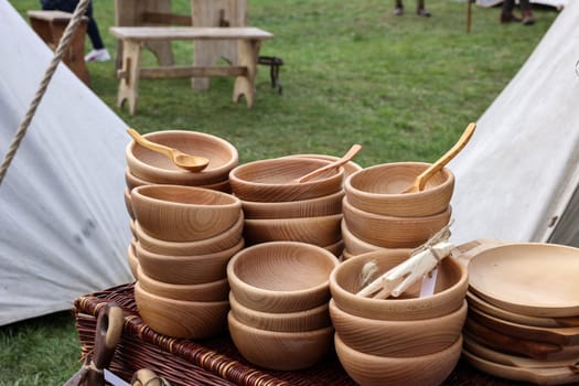 Cracow, Poland - April 11, 2023: Imitations of old wooden vessels in knight camp at the festival of historical reconstruction