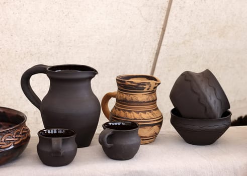 Cracow, Poland - April 11, 2023: Handmade imitations of medieval ceramic vessels in knight camp at the festival of historical reconstruction