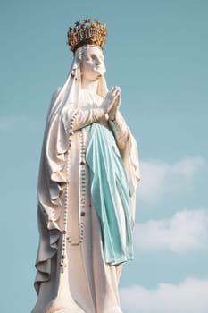 Lourdes, France - August 28, 2021: Sculpture of the crowned Virgin Mary in the Sanctuary of Lourdes, photographed in France