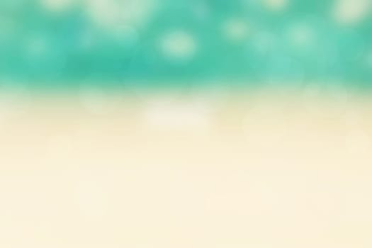 Abstract sea background. Abstract tropical sandy summer beach background with bokeh lights on light blue sky and sun. Beautiful texture. Space.