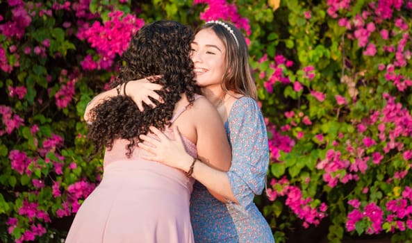 two women friends hugging, girl congratulating and hugging her friend, women's day concept
