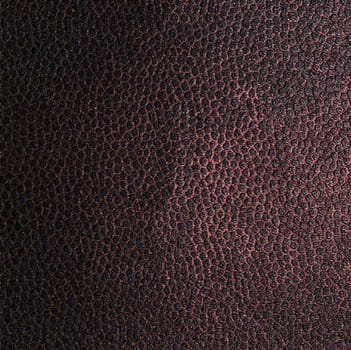The structure of a dark brown fabric in the form of a dot pattern