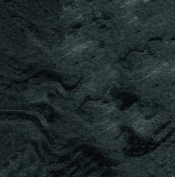 The abstract texture of the background is dark gray with rough uneven relief and lines