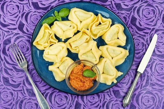Tortelloni stuffed with ricotta cheese and basil pesto.