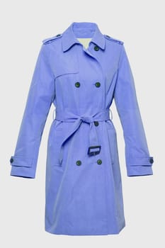 Woman trench coat. A luxurious and stylish elegant female light blue trench coat on mannequin isolated on a white background. Spring and summer fashion.