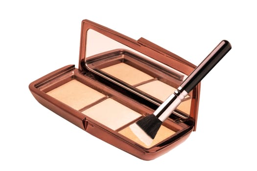 Cosmetic products isolated. Close-up of a elegant cosmetic multi-color box with mirror, eye shadows powder and a eye shadow brush isolated on a white background. Macro.