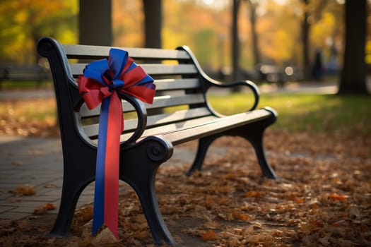 A Patriot Day ribbon tied to a park bench. Generative AI
