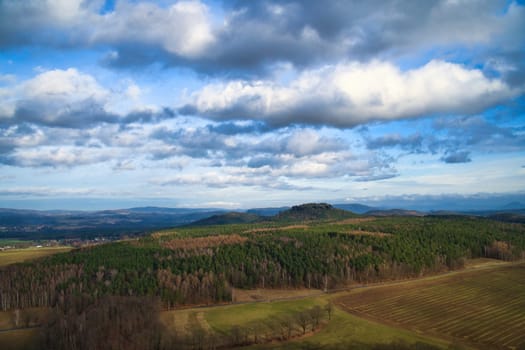 View from the Pfaffenstein. Forests, mountains, fields, vastness, panorama. Landscape from the Elbe Sandstone Mountains.