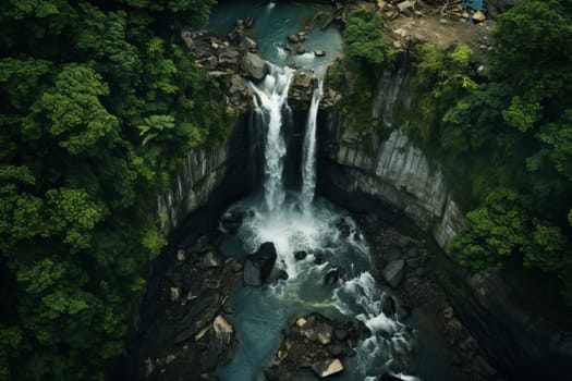 Aerial perspective of a picturesque waterfall hidden in a dense forest