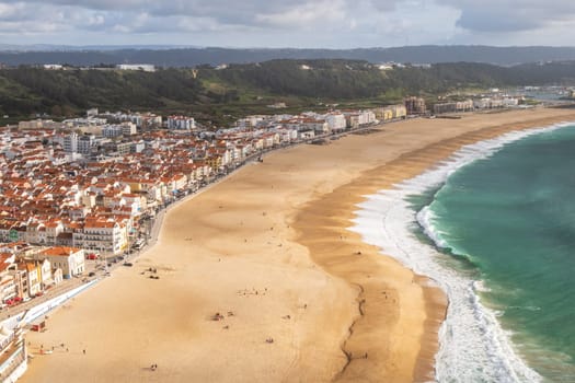 Aerial view over Nazaré, Portugal, down to Nazaré Beach and the Atlantic Ocean