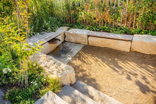 Modern water design with sitting area in a garden, patio or city park