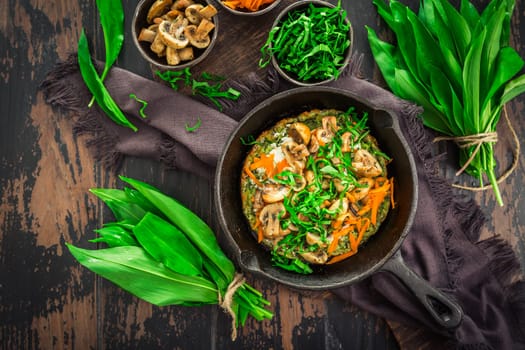 Vegetarian Quiche or oven baked pancake with ramson, carrots and mushrooms.