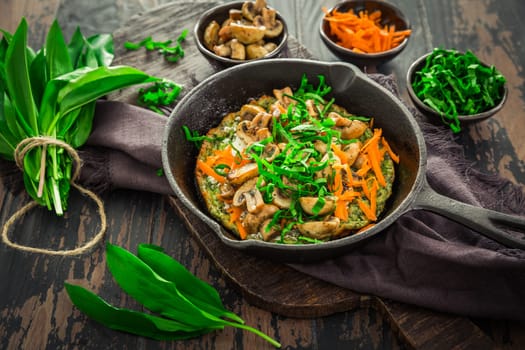 Vegetarian Quiche or oven baked pancake with ramson, carrots and mushrooms.