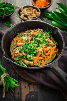 Vegetarian Quiche or oven baked pancake with ramson, carrots and mushrooms.
