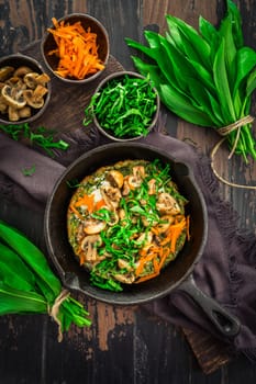 Vegetarian Quiche or oven baked pancake with ramson, carrots and mushrooms.