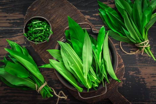 Ramson, wild garlic (allium ursinum) on wooden kitchen table