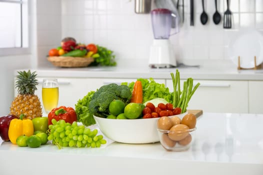 Healthy foods of fresh vegetables, fruits, eggs and pineaple juice on white table in home kitchen . Home healthy lifestyle concept