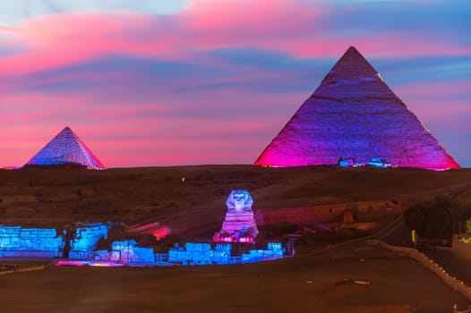 The Pyramid of Egypt and the great Sphinx night view in the lights, Giza.