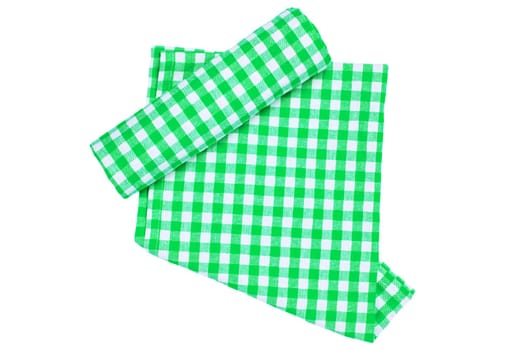 A green white checkered napkin or picnic tablecloth texture with a rolled towel isolated on white. Kitchen towels. Backdrop for your product placement or montage.