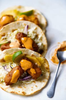 close up of a plate of mexican fish tacos