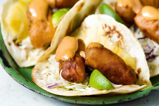 close up of a plate of mexican fish tacos