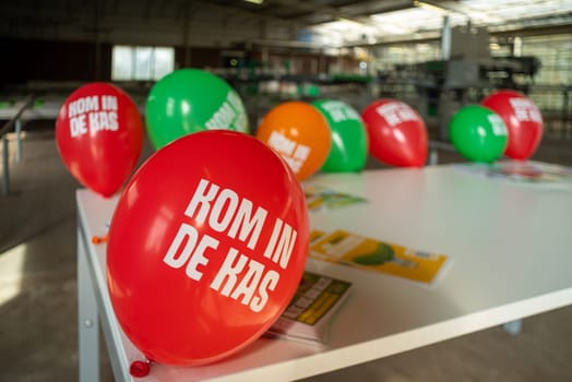 KLAZIENAVEEN, NETHERLANDS - APRIL 7, 2018: Balloons saying "come into the greenhouse"" (kom in de kas in dutch language). It is a yearly event showing people what happens in a commercial greenhouse"