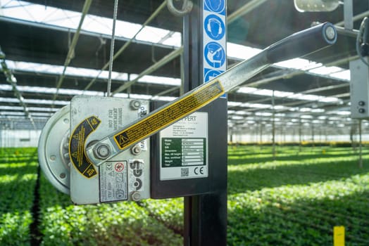 KLAZIENAVEEN, NETHERLANDS - APRIL 7, 2018: turning handle for operating the sunshades in a commercial greenhouse