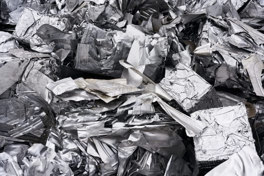 Pressed scrap as raw material for melting down at a scrap yard in the port of Magdeburg in Germany