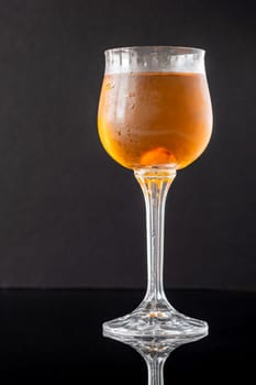 Glass of Waterloo cocktail on the black background