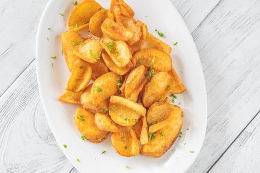 Portion of dip fried potato dippers on the plate
