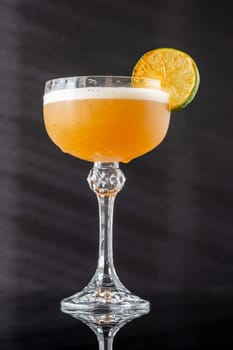 Hoyt's Daiquiri cocktail garnished with seared lime wheel