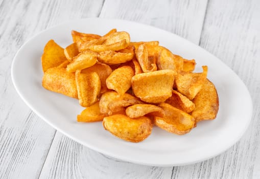 Portion of dip fried potato dippers on the plate