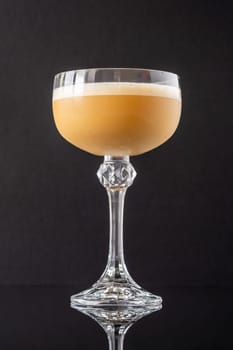 Death Flip cocktail garnished with grated nutmeg
